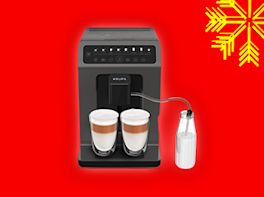 Kaffeevollautomat auf rotem Hintergrund, dekoriert mit gelber Schneeflocke in der Ecke.