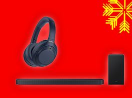 Kopfhörer und eine Soundbar auf rotem Hintergrund, dekoriert mit gelber Schneeflocke in der Ecke.