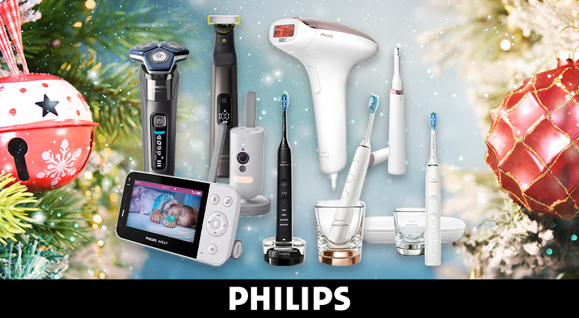 Verschiedene Philips-Produkte, darunter Rasierer, Babyphone und Zahnbürsten, vor weihnachtlichem Hintergrund.