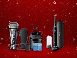 Produktbild eines Rasierers und einer elektrischen Zahnbürste vor rot-weihnachtlichem Hintergrund.