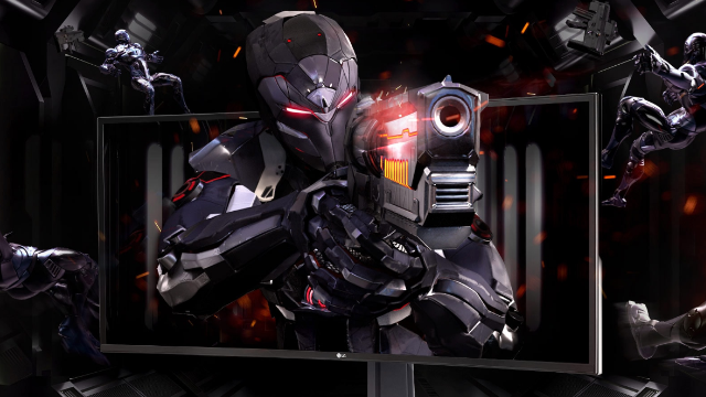 Ein Monitor zeigt einen futuristischen Soldaten mit Waffe vor dunklem, industriellem Hintergrund und anderen Soldaten.