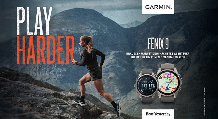 Garmin Fenix 9 Smartwatches neben einer Läuferin in den Bergen mit dem Slogan „Play Harder“ und „Beat Yesterday“.