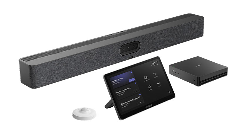 MVC S50‑C5U Microsoft Teams Rooms System: lange schwarze Soundbar mit Kamera, Touch‑Controller, Compute‑Box und rundes Tischmikrofon.