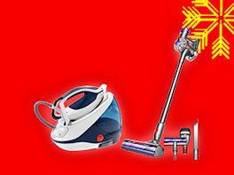 Dampfbügeleisen und Stick-Staubsauger auf rotem Hintergrund, dekoriert mit gelber Schneeflocke in der Ecke.