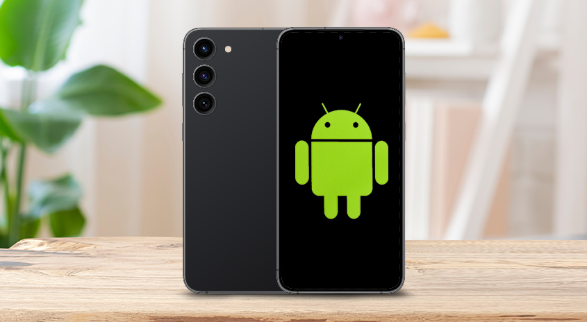 Zwei Smartphones: Eines schwarz mit drei Kameras, das andere mit grünem Android-Logo auf schwarzem Bildschirm.