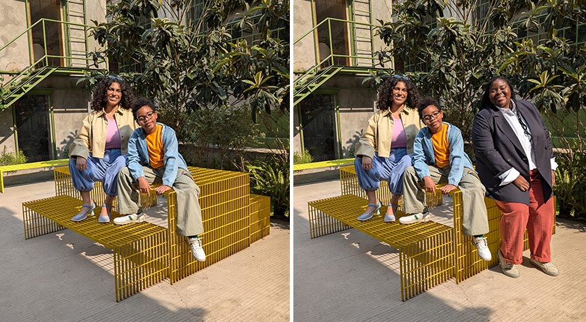 Sicherheitsbank aus gelbem Metall vor Gebäude mit Treppe. Grüne Pflanzen im Hintergrund.