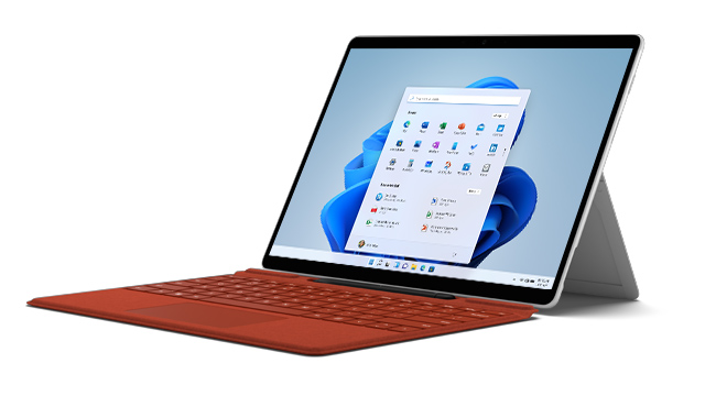 Ein Tablet-PC mit einem roten Tastaturcover steht auf einem weißen Untergrund. Auf dem Bildschirm wird ein Menü angezeigt.