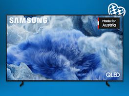 Ein TV-Gerät vor blauem Hintergrund. In der rechten Ecke oben ist ein Herzsymbol in weiß-blau zu sehen.