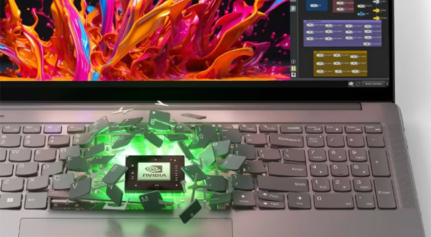 Ein Laptop mit einer Grafikkarte und bunten Elementen auf dem Bildschirm. Die Tastatur ist teilweise zerbrochen.