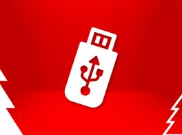 Weißes Piktogramm eines Speicher-Sticks vor weihnachtlich-rotem Hintergrund.