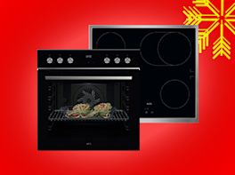 Herd-Set auf rotem Hintergrund, dekoriert mit gelber Schneeflocke in der Ecke.