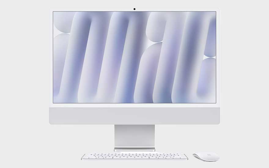 Un Apple iMac M4 blanc avec clavier et souris est centré, affichant des formes abstraites violettes douces.