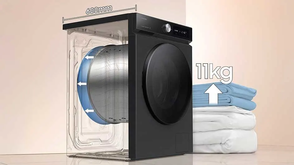 Zwarte wasmachine met een transparant deel dat de trommel toont. Stapel van blauwe en witte handdoeken rechts. 11kg tekst met pijl omhoog.