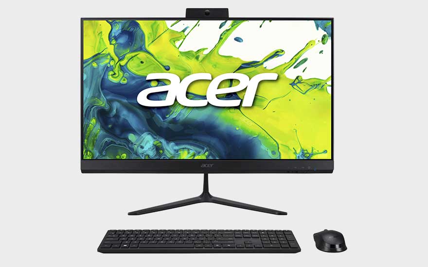 Un ordinateur tout-en-un Acer avec clavier et souris noirs affiche un écran vert et bleu vif avec un grand logo blanc.