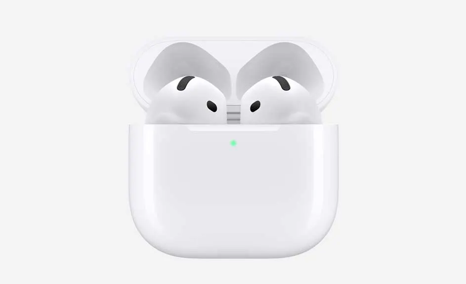 White wireless earbuds sit in an open, white charging case with a small green light on a white background.