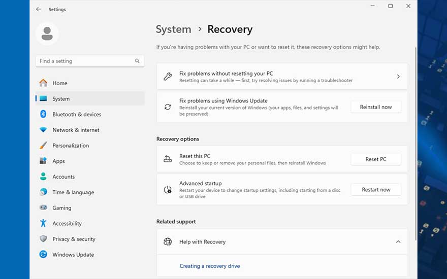 Het venster 'Systeemherstel' in Windows toont opties om problemen op te lossen en de pc te herstellen, met blauwe accenten aan de zijkant.
