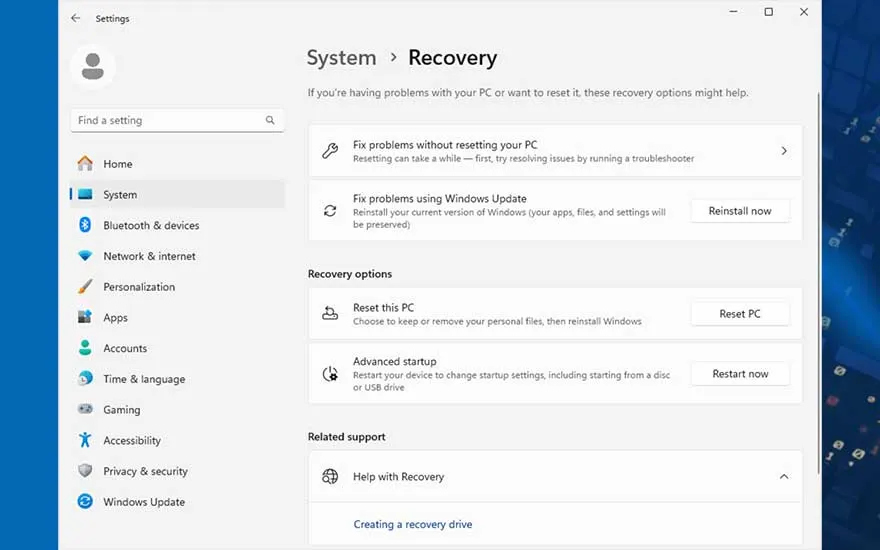 Fenêtre "Paramètres" de Windows affichant les options de récupération du système sur fond bleu.