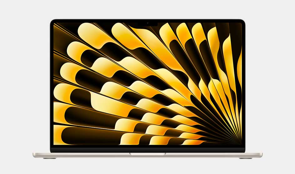 A slim laptop displays a screen of golden fanlike shapes on deep black, like folded ribbons that flare outward across it.