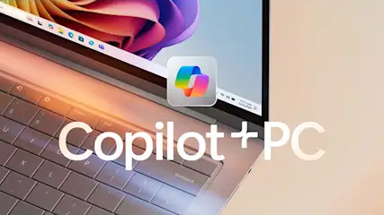 Een open laptop met een grijs toetsenbord en een scherm met een logo en de tekst "Copilot + PC".