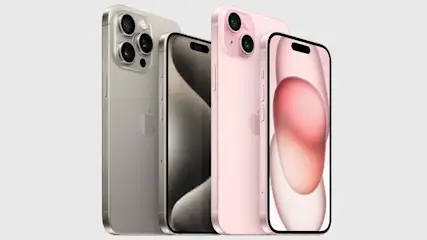 Twee iPhones, een gouden en een roze, staan op een witte achtergrond. De schermen tonen achtergronden in grijstinten en roze.