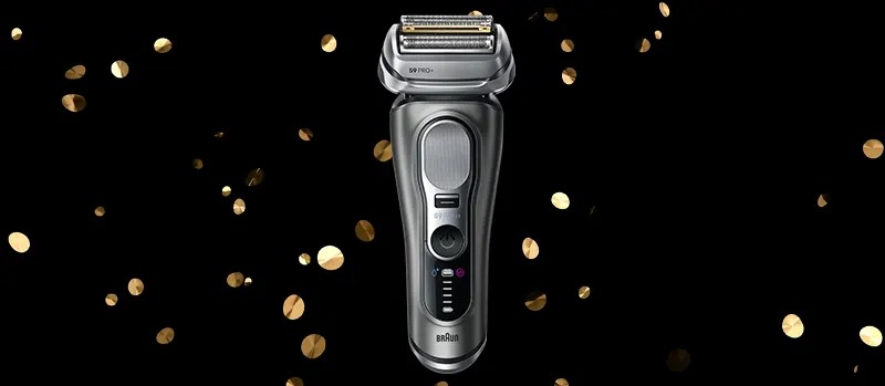 L’image montre un rasoir Braun moderne de couleur argentée sur un fond noir avec des confettis dorés.