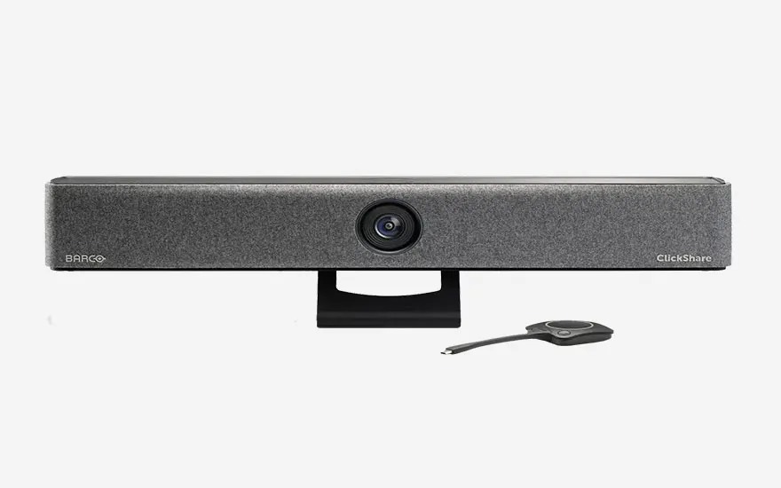 Een Barco ClickShare videobar en een ClickShare-knop liggen samen, ideaal voor draadloze videoconferencing in vergaderruimtes.