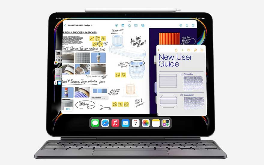 Tablette noire avec clavier gris, affichant des croquis de conception et un guide de l'utilisateur. Un stylet est fixé.