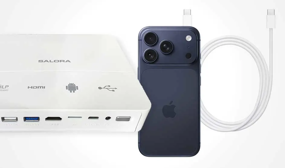 Witte projector of adapter naast een donkere iPhone, met een kabel erbij en zichtbare poorten voor video, USB en stroom.