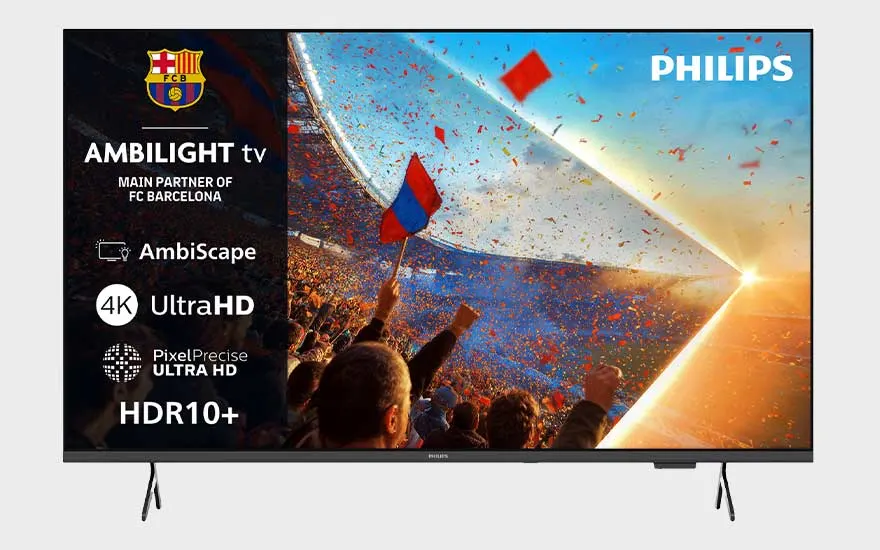 Een Philips Ambilight-tv toont een vol stadion met Barça-vlaggen, confetti en felle zon, plus meerdere technische kenmerken links.