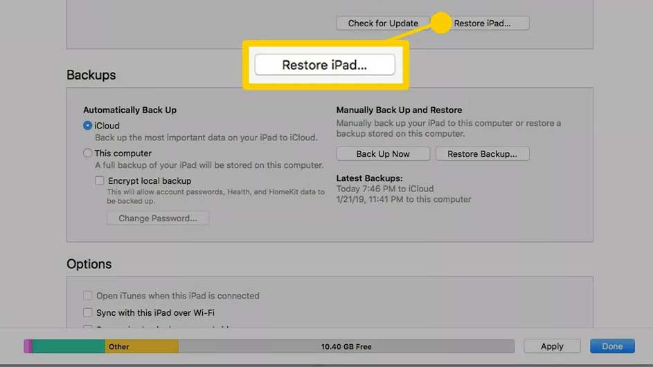 Capture d'écran de paramètres gris avec les options de sauvegarde iPad, mettant en évidence le bouton "Restaurer iPad".