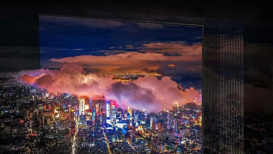 Een scherm toont een nachtelijk stadsbeeld met gebouwen en wolken onder een donkere hemel. Een gestippeld paneel staat rechts.