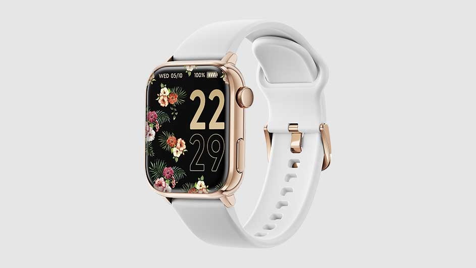 Smartwatch with a white band. The watch face is black with flowers and the time 22:29. The watch casing is gold.