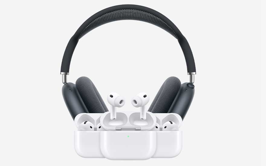 A sleek over ear headset stands behind several pairs of white wireless earbuds in open charging cases, arranged neatly on a light background.
