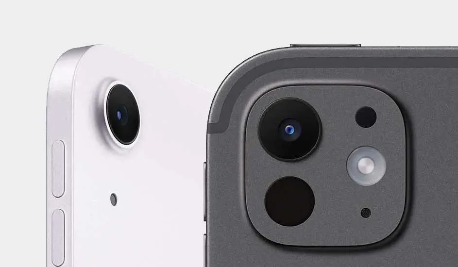 Two tablets are shown closely. One is white with one camera lens. The other is dark gray with three lenses and a flash.