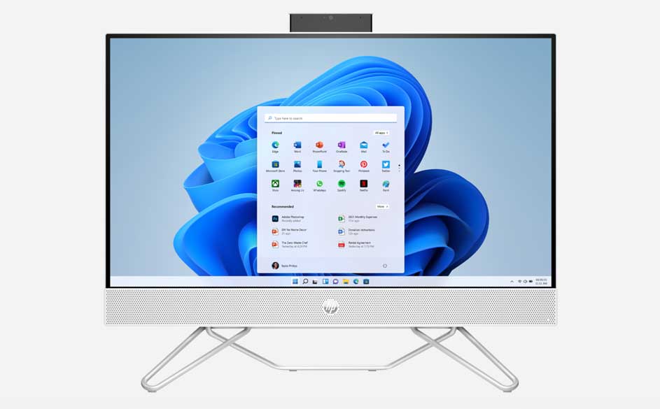 Een witte all-in-one computer met een scherm dat Windows-apps toont, staat op een witte achtergrond.