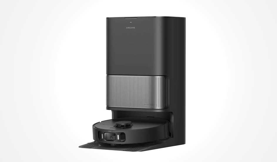 Black robot vacuum sits in a tall docking and dust station, with sleek compact design for automatic charging and emptying against a light backdrop.