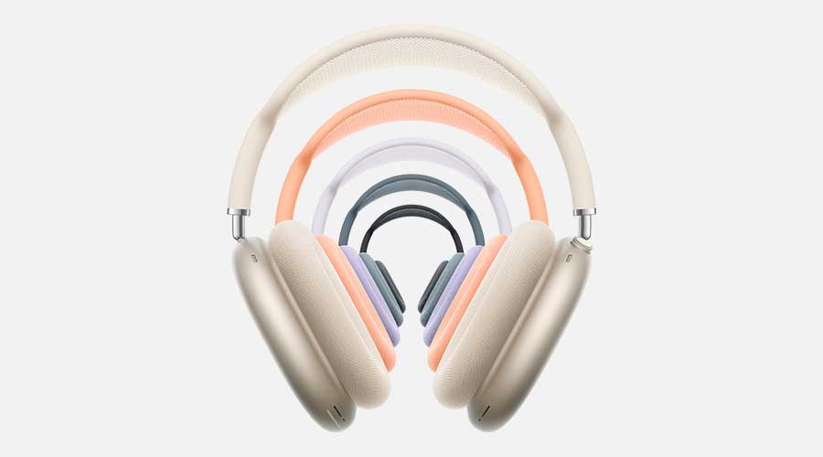 Large beige headphones in front with arches of smaller colourful versions behind, all seeming to float against a plain, softly lit background.