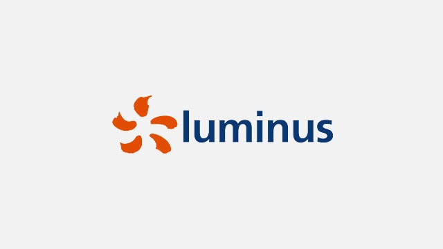 Logo on a white background. An orange, stylized flower is to the left of the blue text "luminus".