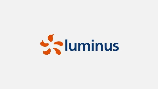 Logo on a white background. An orange, stylized flower is to the left of the blue text "luminus".