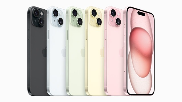 Rij van iPhones: zwart, wit, groen, geel, roze. Rechthoekige vorm, afgeronde hoeken, dubbele cameralenzen. Scherm toont abstracte roze vorm.