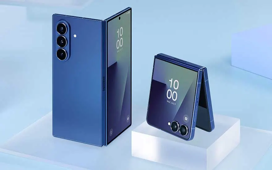 Two blue Samsung foldable phones are shown open and half-folded on a pale blue podium, with screens and cameras clearly visible.
