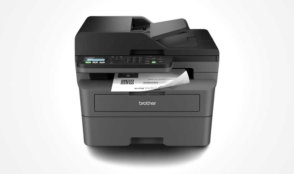 A compact black Brother printer stands against a white background. It features a scanner, control panel, paper tray, and a sheet emerging from the front.