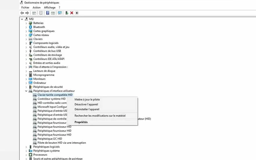 Gestionnaire de périphériques Windows affichant les options du pilote de clavier tactile HID. Menu contextuel "Propriétés" ouvert.