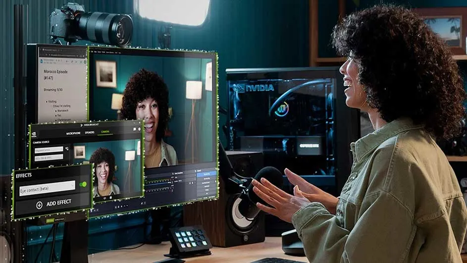 Een opstelling met een camera op een monitor, een computer met Nvidia logo, een microfoon en een luidspreker in een kamer.
