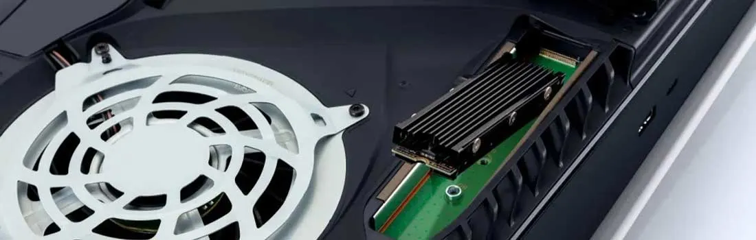 An open PlayStation 5 with a fan and an SSD expansion drive installed, visible in the dedicated slot.