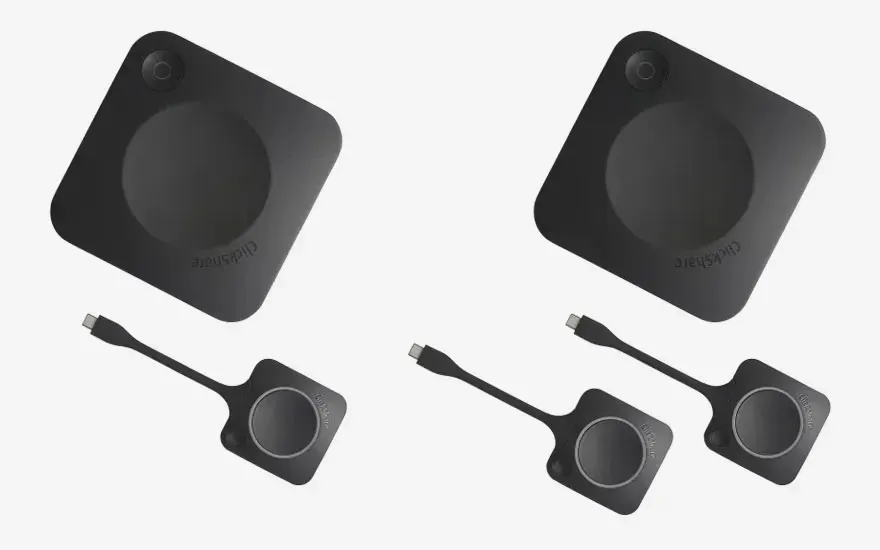 Two ClickShare base units, each with two matching USB-C buttons, illustrating a solution for larger collaborative teams.