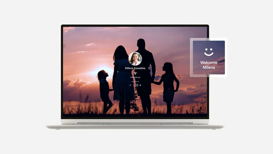 Laptop met een inlogscherm met een silhouetfoto van een gezin bij zonsondergang en een welkomstmelding voor Milena.