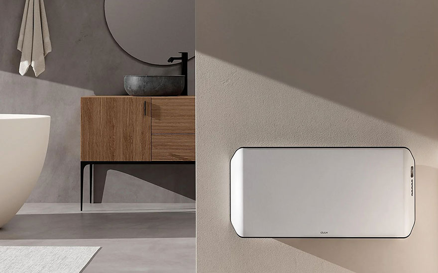 Een badkamer toont een houten wastafelmeubel, een ronde spiegel en een witte radiator aan de muur.