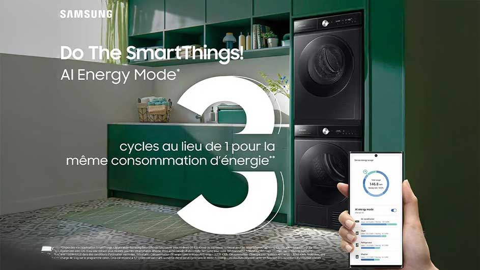 Un intérieur vert olive montre une machine à laver/séchoir noire, un comptoir, des étagères et un smartphone affichant l'énergie.