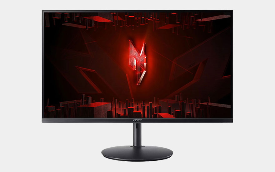 Un moniteur gaming Acer avec un paysage urbain cyberpunk rouge dramatique, logo cristal lumineux au centre et support noir.